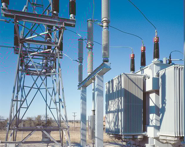 Daytime photo of a Series 2000 Circuit-Switcher installed at a fenced in substation lineup Series 2000, Circuit Switcher, Substation, fault interrupting, transformer switching, protection